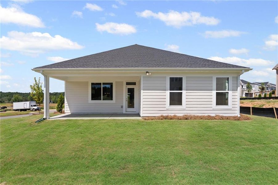 Front exterior of a new home in Twin Lakes, Hoschton, GA, highlighting curb appeal (Image 22). Front exterior of a new home in Twin Lakes, Hoschton, GA, highlighting curb appeal (Image 22).