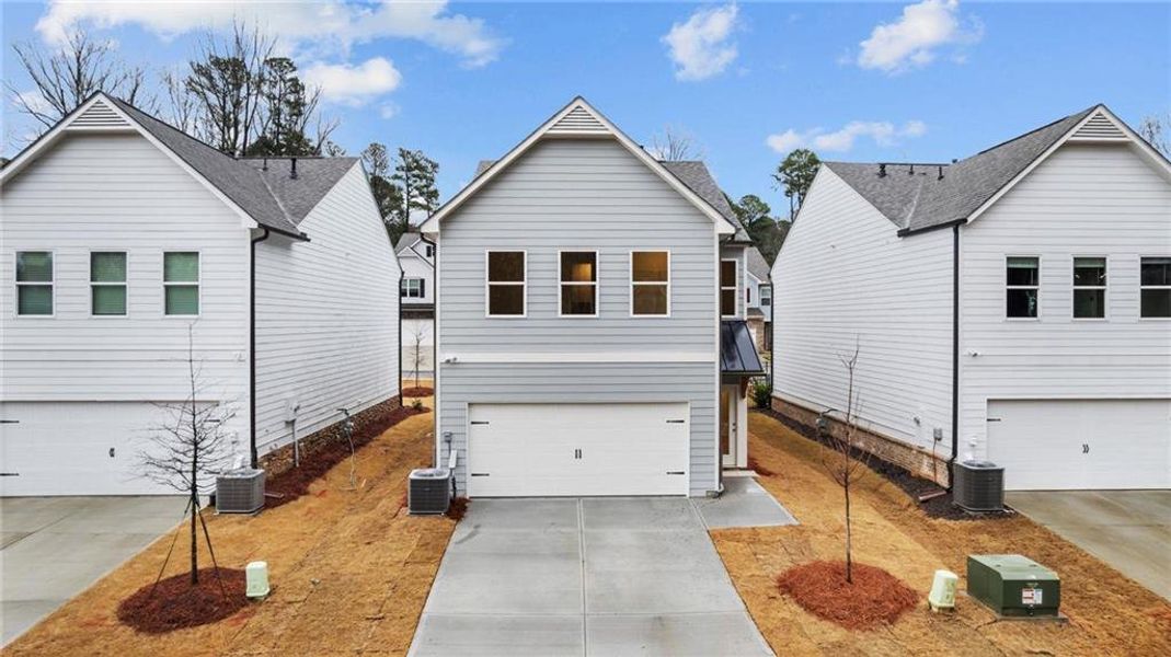 Front exterior of a new home in Castleberry Pointe, Dawsonville, GA, highlighting curb appeal (Image 2). Front exterior of a new home in Castleberry Pointe, Dawsonville, GA, highlighting curb appeal (Image 2).
