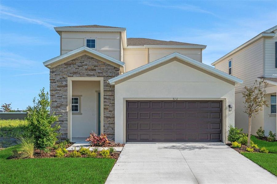 Front exterior of a new home in Seaire, Parrish, FL, highlighting curb appeal (Image 1). Front exterior of a new home in Seaire, Parrish, FL, highlighting curb appeal (Image 1).