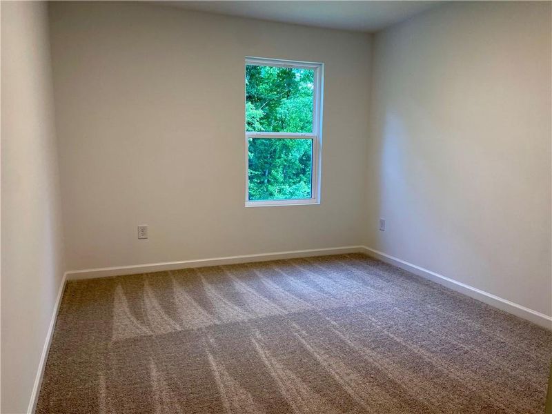 Spacious, unfurnished interior of a new home in Eastlyn Crossing, Flowery Branch (Image 17).