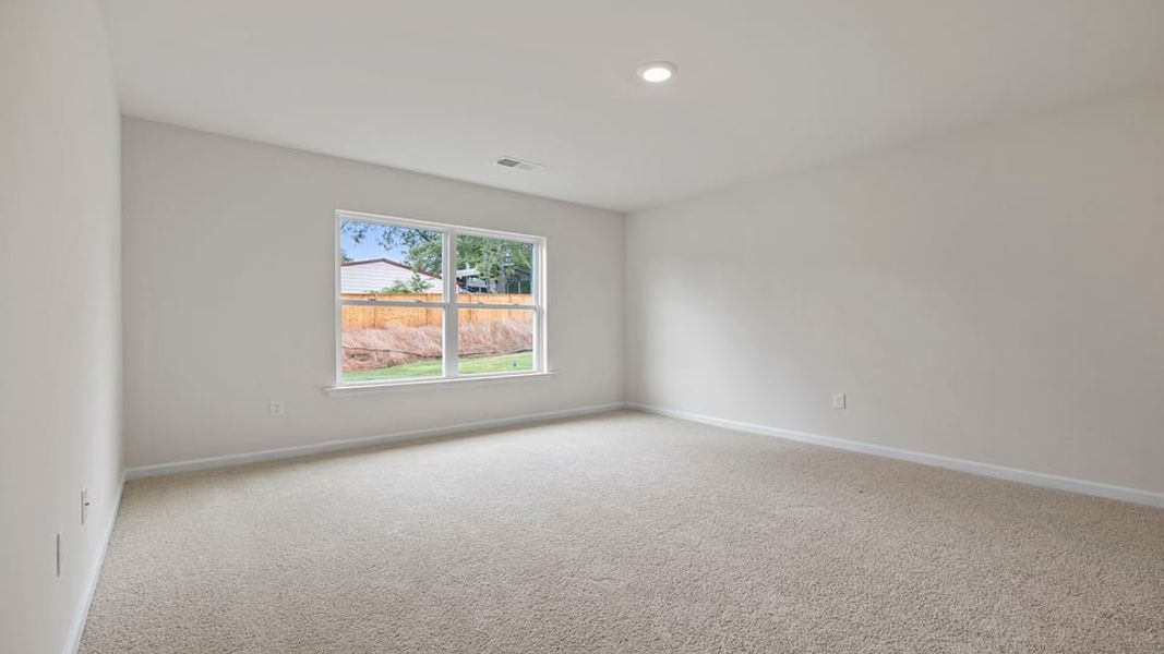 Spacious, unfurnished interior of a new home in Bentley Park, Greenwood (Image 23).