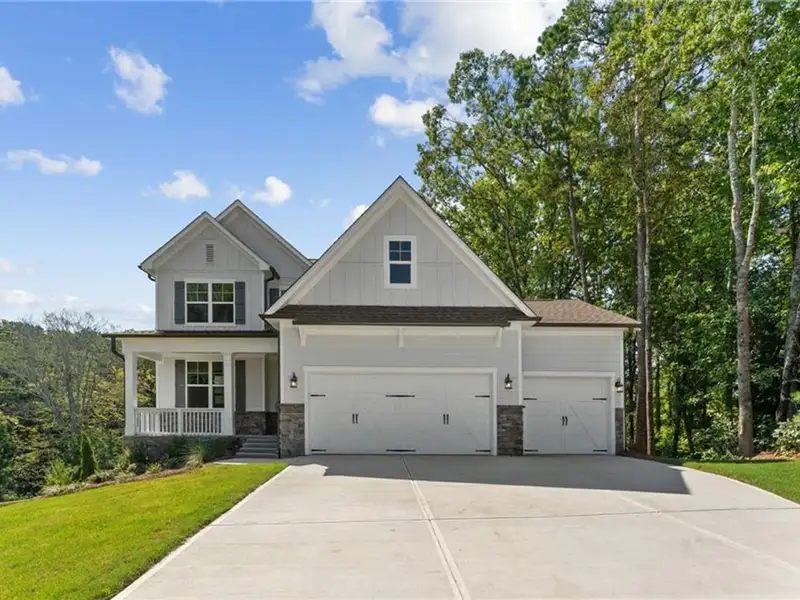 Front exterior of a new home in Riverwood, Dallas, GA, highlighting curb appeal (Image 2).