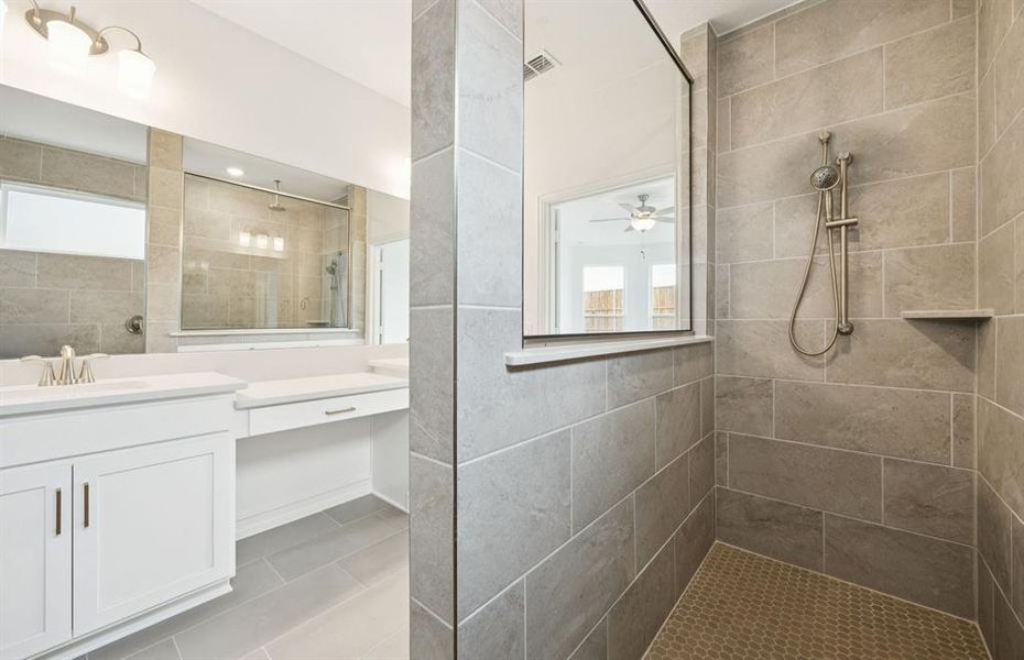 Deep walk-in shower designed for relaxation in the owner's bath *Real home pictured Deep walk-in shower designed for relaxation in the owner's bath *Real home pictured