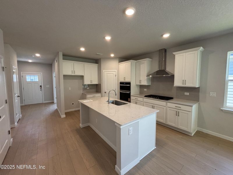 Furnished interior view inside a new home in The Magnolia Series at Reserve East, Flagler Beach (Image 8).