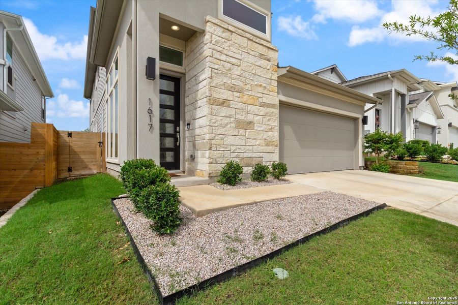 Front exterior of a new home in , Pflugerville, TX, highlighting curb appeal (Image 20).