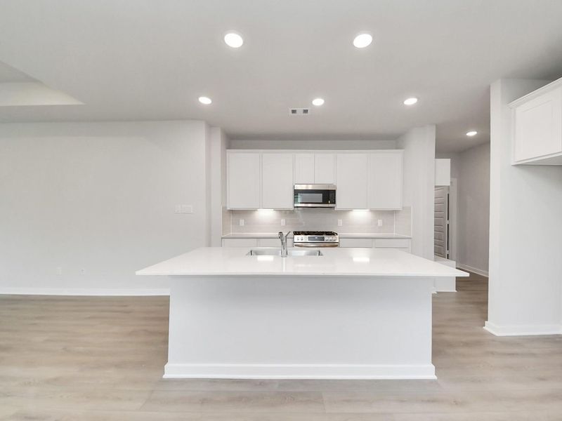 Furnished interior view inside a new home in Caney Creek Place, Conroe (Image 6).