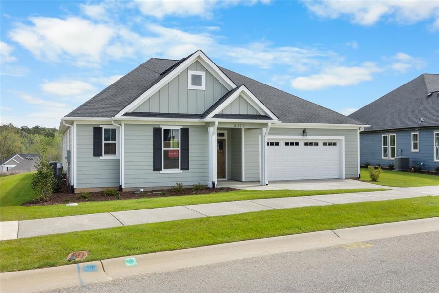 Front exterior of a new home in Sinclair at Crawford Creek, Grovetown, GA, highlighting curb appeal (Image 22). Front exterior of a new home in Sinclair at Crawford Creek, Grovetown, GA, highlighting curb appeal (Image 22).