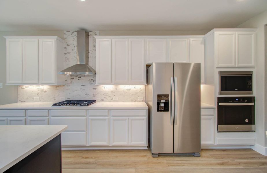 Furnished interior view inside a new home in Harper's Preserve - Classic Series, Conroe (Image 10). Furnished interior view inside a new home in Harper's Preserve - Classic Series, Conroe (Image 10).