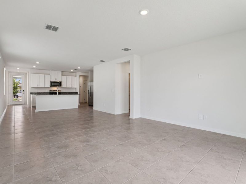 Spacious, unfurnished interior of a new home in The Reserve at Hammock Oaks - Classic Series, Lady Lake (Image 9).