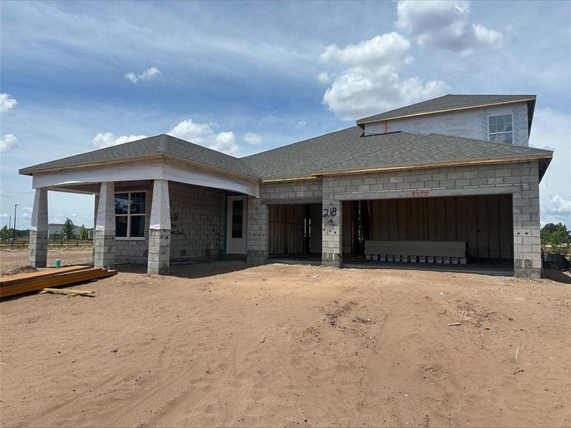 Front exterior of a new home in Center Lake on the Park, St. Cloud, FL, highlighting curb appeal (Image 1).