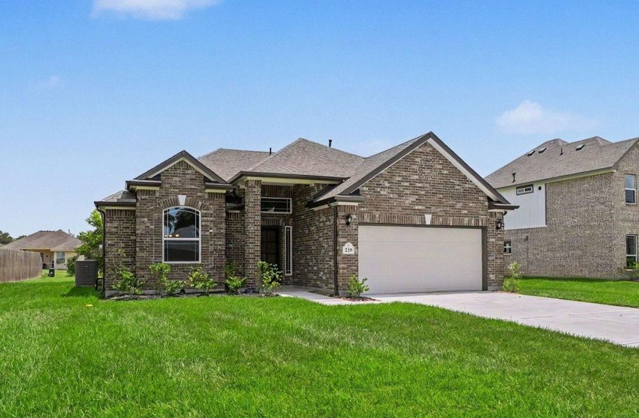 Front exterior of a new home in Columbia Lakes, West Columbia, TX, highlighting curb appeal (Image 20).