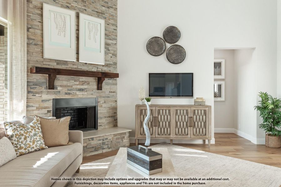 Living room with stacked stone fireplace, wood mantel, hardwood floors, and neutral furnishings Living room with stacked stone fireplace, wood mantel, hardwood floors, and neutral furnishings