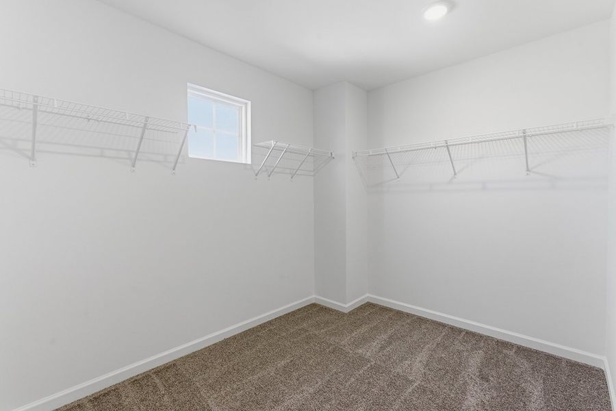 A white room with a staircase.
