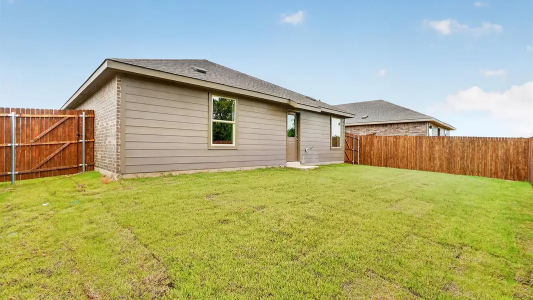 Exterior details and patio area of a home in Springhill South, Boyd (Image 3).