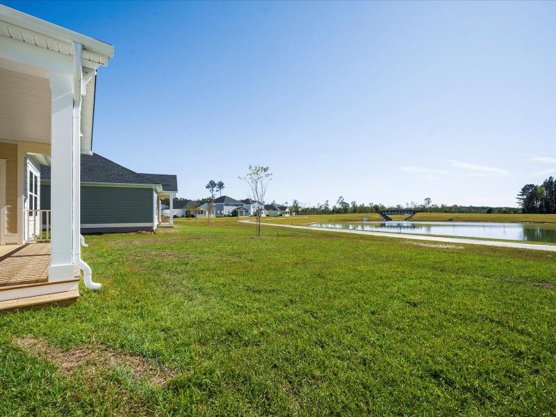 Exterior details and patio area of a home in The Coves at Lakes of Cane Bay II, Summerville (Image 24).