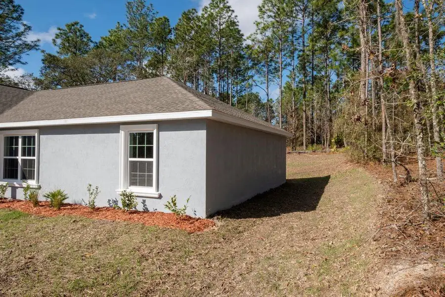 Exterior details and patio area of a home in , Citrus Springs (Image 25).