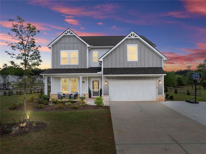 Front exterior of a new home in , Dacula, GA, highlighting curb appeal (Image 2).