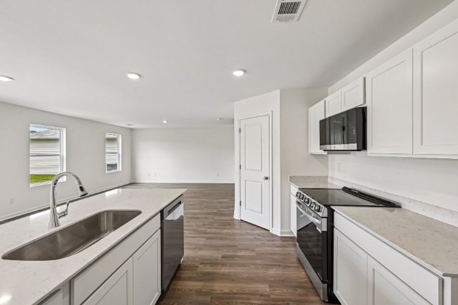 A kitchen with white cabinets. A kitchen with white cabinets.