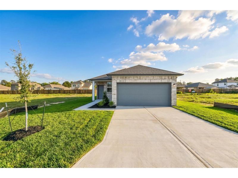 Front exterior of a new home in Liberty Estates, Cleveland, TX, highlighting curb appeal (Image 1). Front exterior of a new home in Liberty Estates, Cleveland, TX, highlighting curb appeal (Image 1).