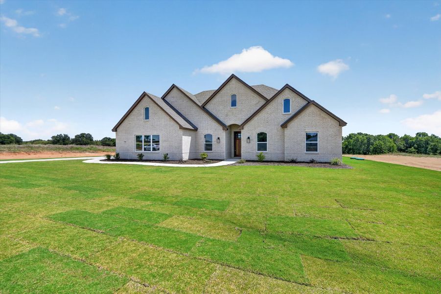 Front exterior of a new home in Taylor Ranch, Springtown, TX, highlighting curb appeal (Image 25).