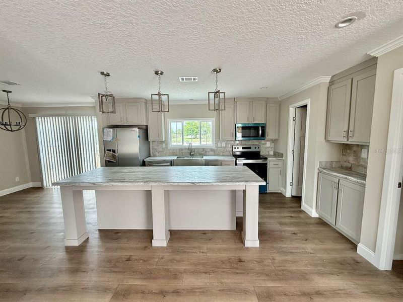 Furnished interior view inside a new home in , Okeechobee (Image 10).