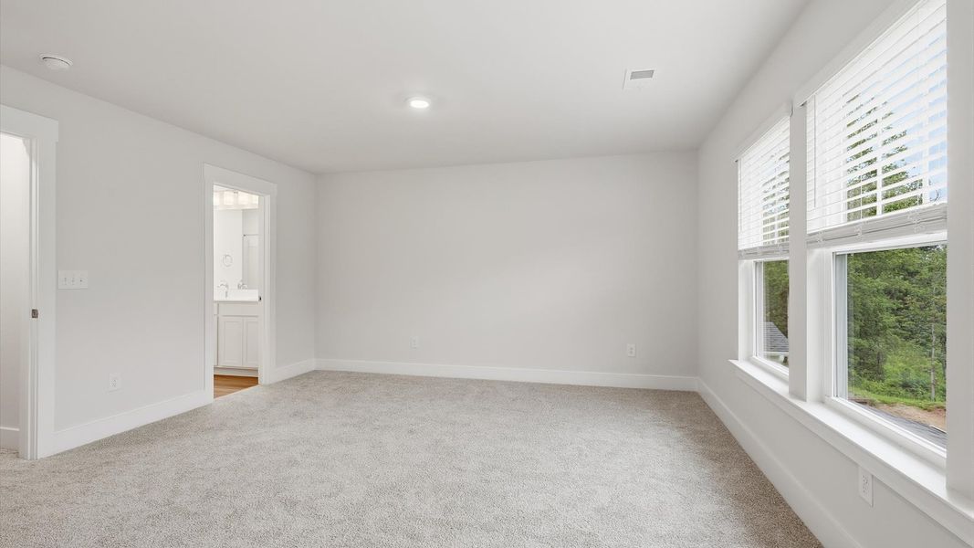 Primary suite that offers first-rate relaxation with established style and elevated finishes