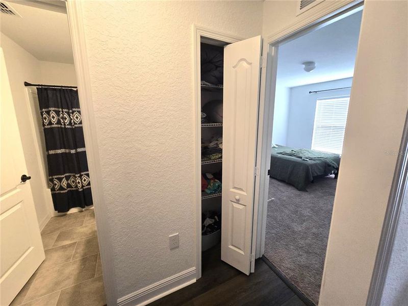 Across the house to the 3 and 4th bedrooms