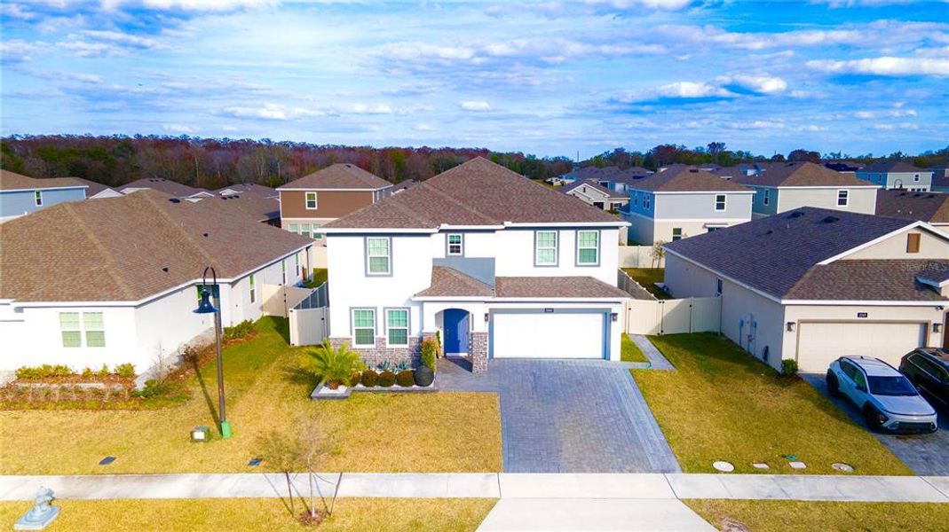 Front exterior of a new home in Storey Creek, Kissimmee, FL, highlighting curb appeal (Image 27).