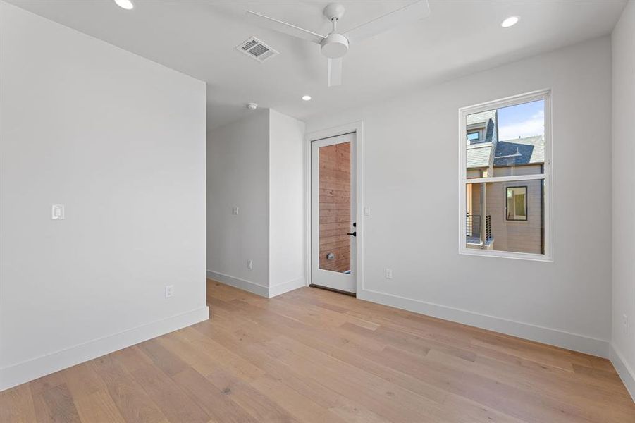 Primary bedroom with private balcony.