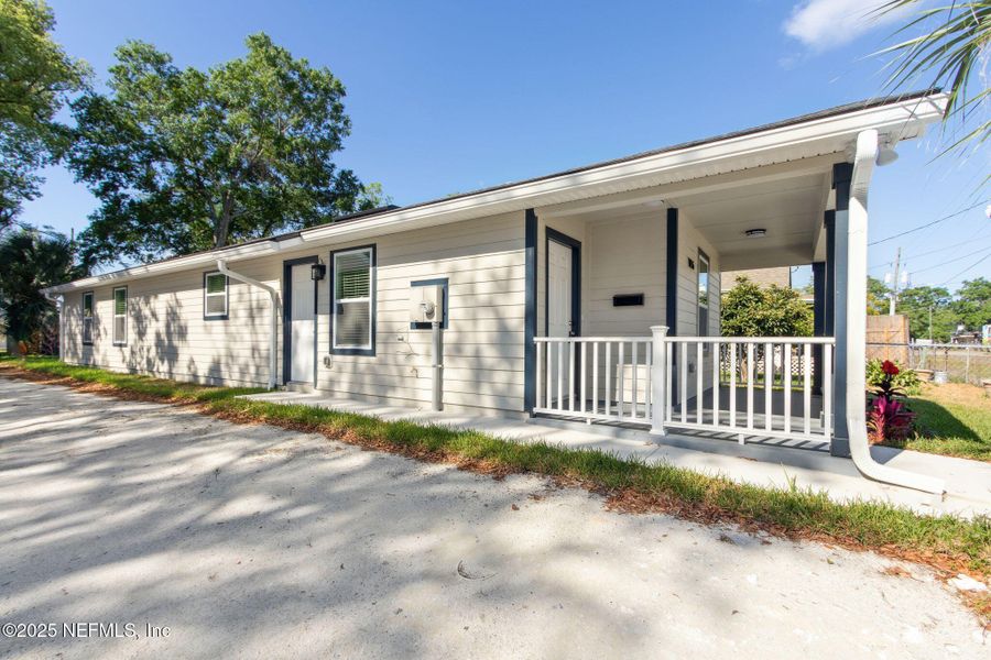 Front exterior of a new home in , Jacksonville, FL, highlighting curb appeal (Image 1).