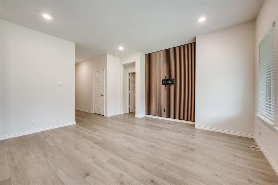 Empty room featuring recessed lighting and light wood-style flooring