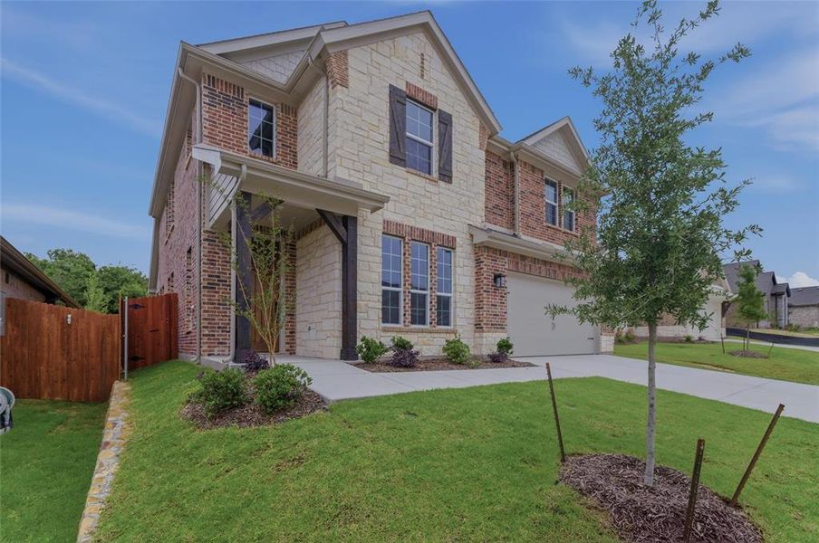 Stone and brick exterior with dark wood shutters