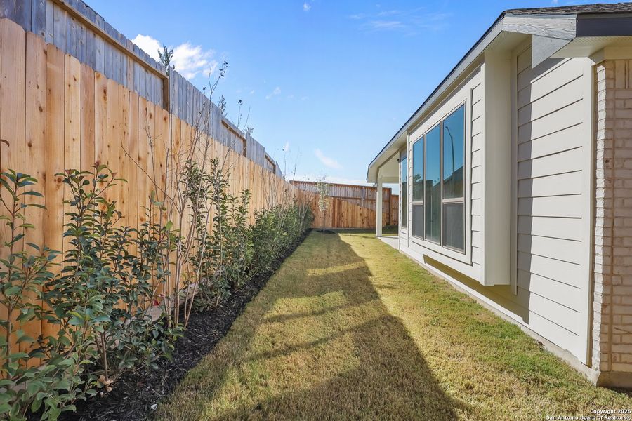 Exterior details and patio area of a home in Homestead 65', Schertz (Image 4).