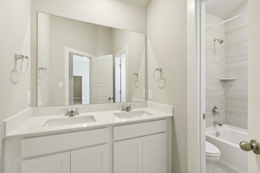 Guest bathroom in the Cedar floorplan at a Meritage Homes community.