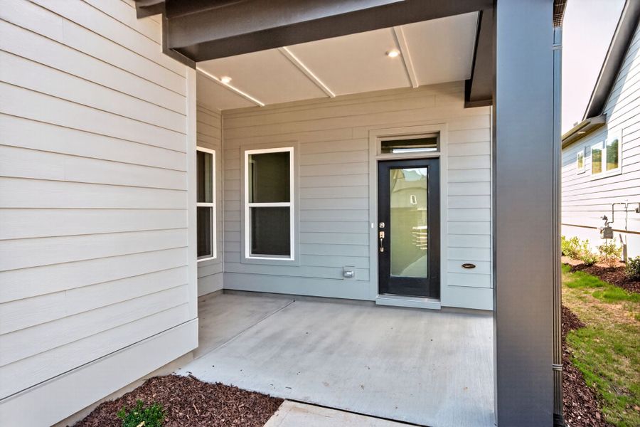 Exterior details and patio area of a home in Encore at Chatham Park – Villa Series, Pittsboro (Image 3). Exterior details and patio area of a home in Encore at Chatham Park – Villa Series, Pittsboro (Image 3).
