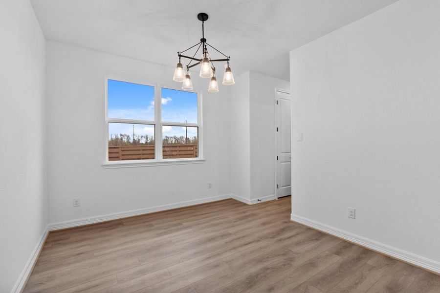 The dining room is spacious and is punctuated with a statement making chandelier. The dining room is spacious and is punctuated with a statement making chandelier.