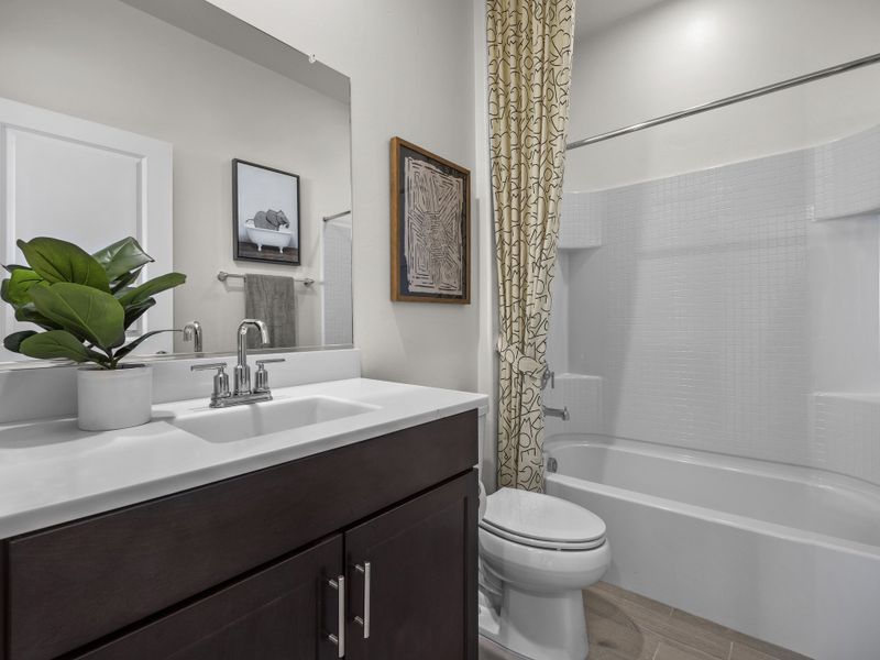 Second bathroom conveniently located between bedrooms two and three.