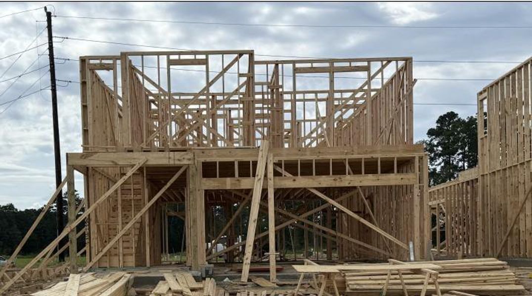 Front exterior of a new home in Lakes at Black Oak, Magnolia, TX, highlighting curb appeal (Image 2). Front exterior of a new home in Lakes at Black Oak, Magnolia, TX, highlighting curb appeal (Image 2).