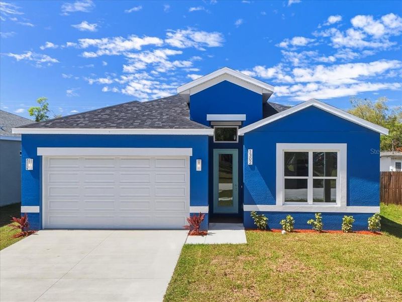 Front exterior of a new home in , Orlando, FL, highlighting curb appeal (Image 1). Front exterior of a new home in , Orlando, FL, highlighting curb appeal (Image 1).