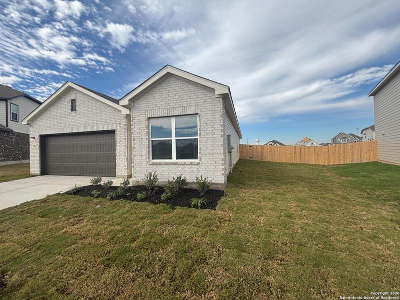 Front exterior of a new home in The Summit at Saddlebrook Ranch 55's, Schertz, TX, highlighting curb appeal (Image 21).