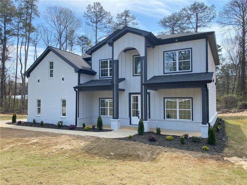 Front exterior of a new home in , Snellville, GA, highlighting curb appeal (Image 29).