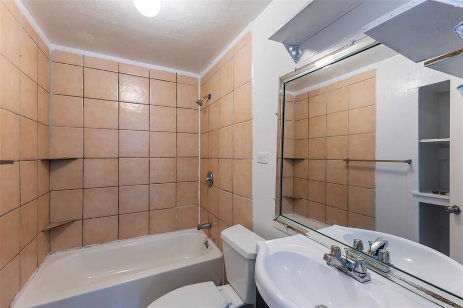 Bathroom featuring shower / washtub combination and vanity Bathroom featuring shower / washtub combination and vanity