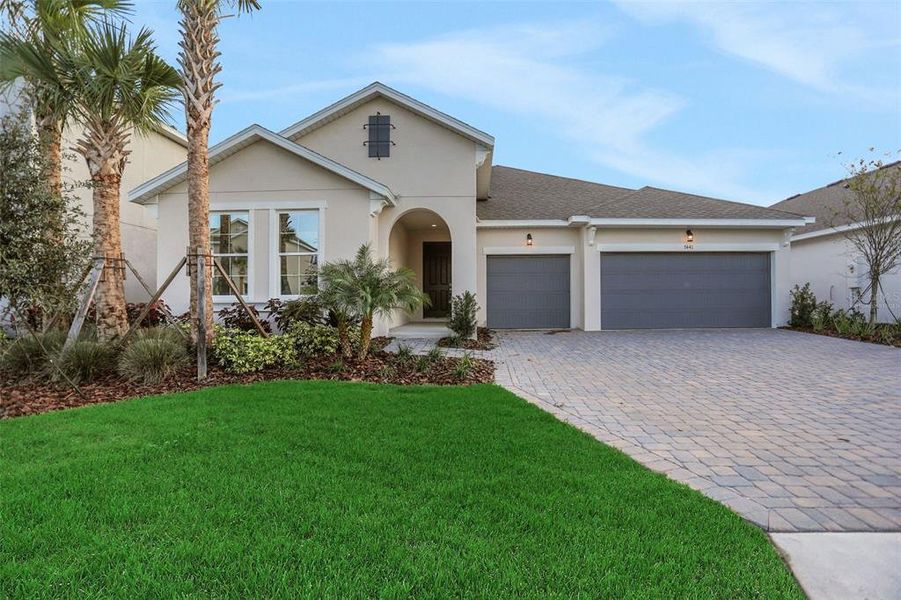 Front exterior of a new home in Seaire, Parrish, FL, highlighting curb appeal (Image 23).