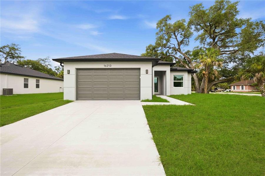 Front exterior of a new home in , Port Charlotte, FL, highlighting curb appeal (Image 27).