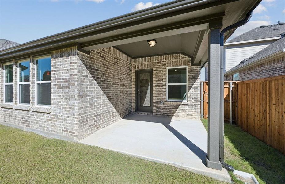 Large covered patio offers ample space for entertaining or relaxing Large covered patio offers ample space for entertaining or relaxing