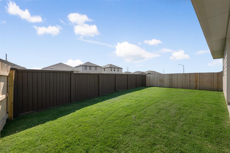 Front exterior of a new home in Rolling Glen, Hutto, TX, highlighting curb appeal (Image 24). Front exterior of a new home in Rolling Glen, Hutto, TX, highlighting curb appeal (Image 24).