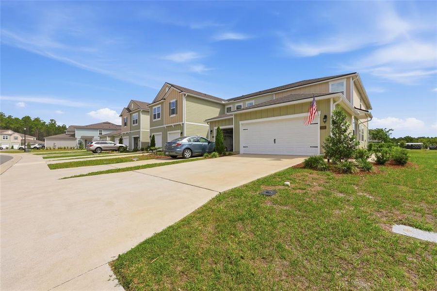 Front exterior of a new home in , Palm Coast, FL, highlighting curb appeal (Image 28).
