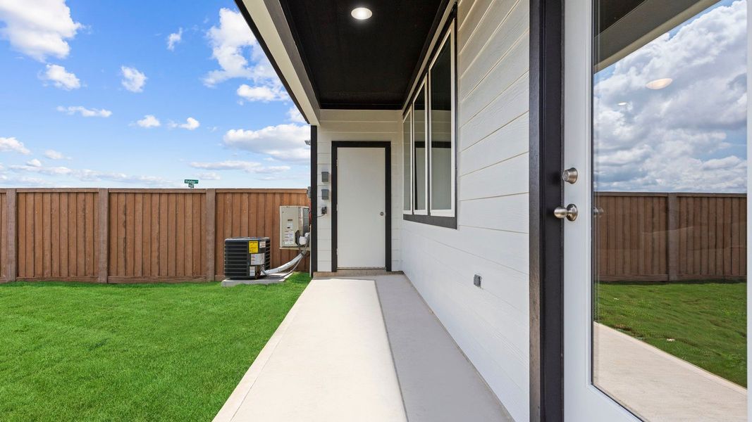 Exterior details and patio area of a home in Villarosa at Tamarron, Katy (Image 2).