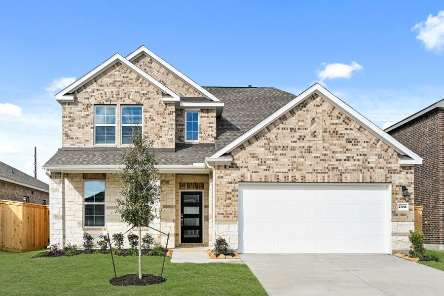 Front exterior of a new home in Sunterra, Katy, TX, highlighting curb appeal (Image 21).
