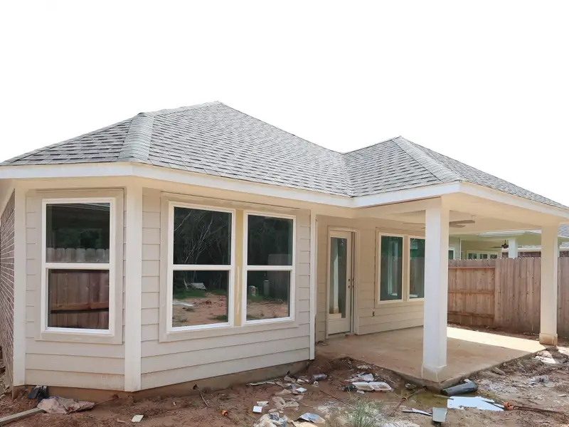 Front exterior of a new home in Sorella, Tomball, TX, highlighting curb appeal (Image 2). Front exterior of a new home in Sorella, Tomball, TX, highlighting curb appeal (Image 2).